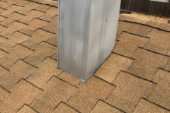 Incorrectly installed chimney chase flashing and T-Lock roof shingles, both are problems for different reasons