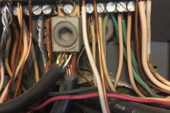 Double tapping with a copper and a aluminum wire at the main neutral lug...Not a recommended practice.