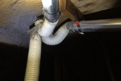 Two bathroom fan vent hoses and the dryer vent hose...all loosely connected to a roof vent in the attic.