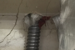This conduit penetrates part of the fire separation wall in a garage and should be sealed. It appears they started to caulk the gap with fire resistant caulk and then ran out?