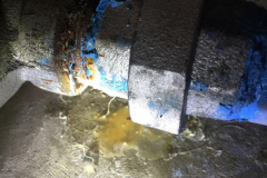 This is a slight weep on the line connecting a well pump to the a pressure tank...this could get worse, fast.